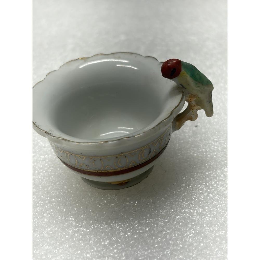 Vintage porcelain child's teacup with parrot bird handle Japan